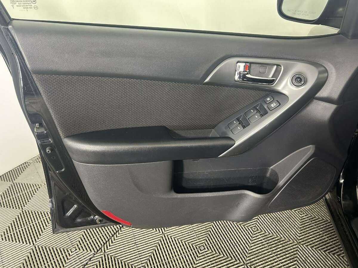 Kia Cerato 2013 года с пробегом. Фото: #5